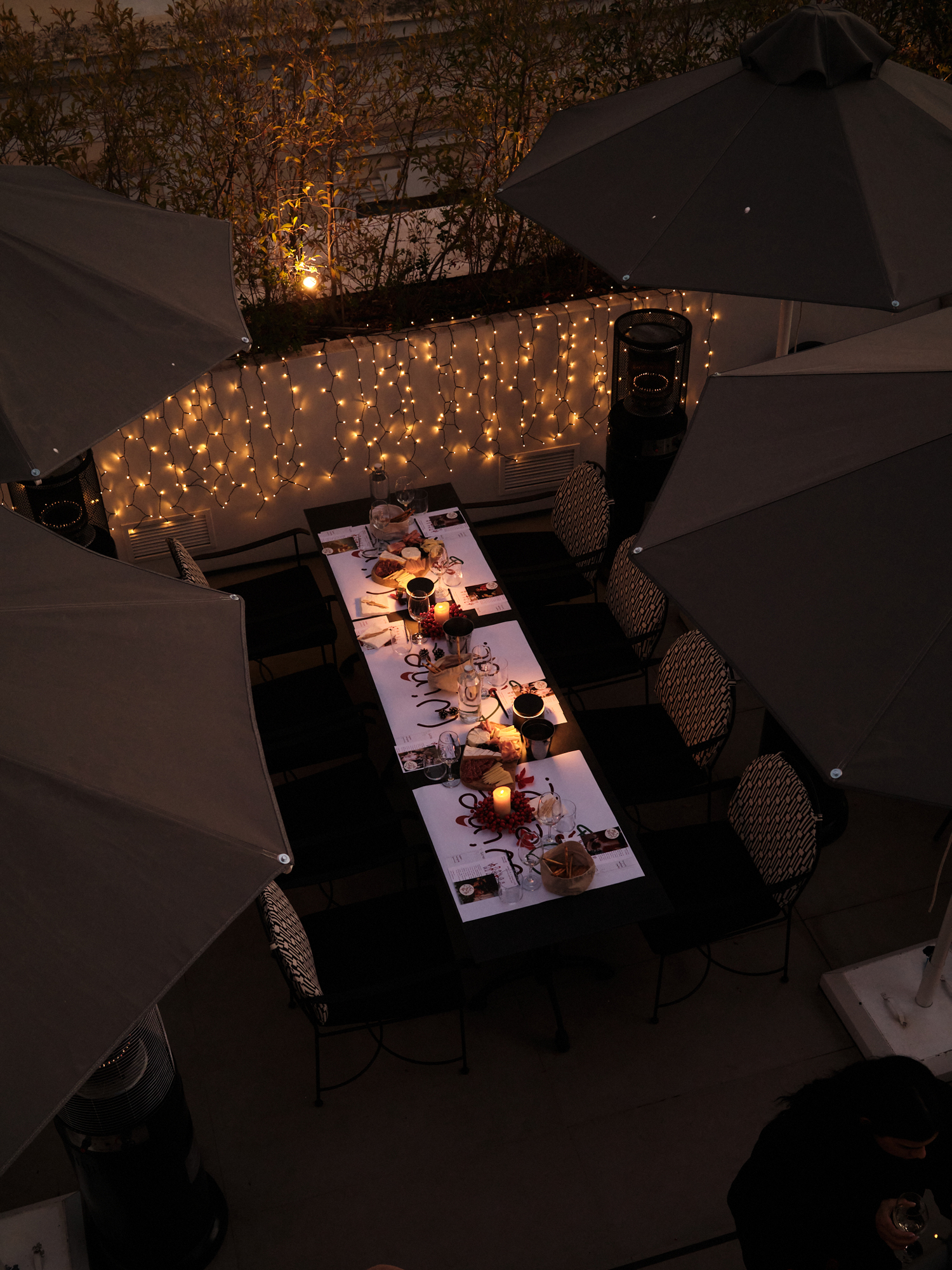 Rooftop dinner under fairy lights